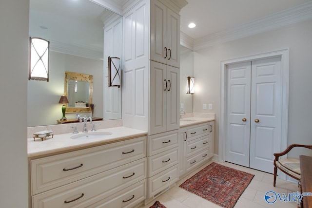 bathroom featuring crown molding, tile patterned floors, and vanity