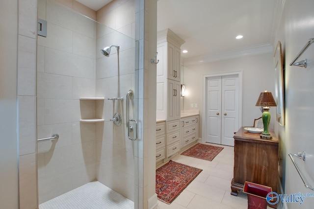 bathroom featuring vanity, crown molding, tile patterned floors, and an enclosed shower