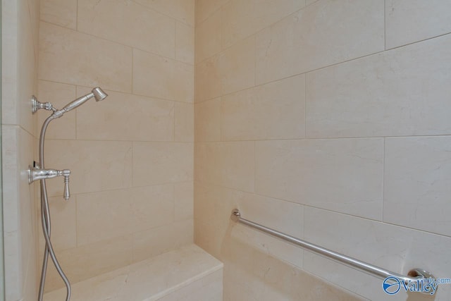 bathroom with tiled shower