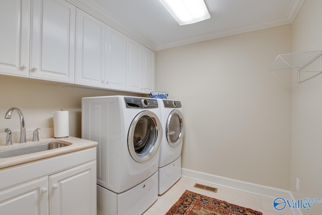 laundry room featuring separate washer and dryer, light tile patterned flooring, cabinets, ornamental molding, and sink