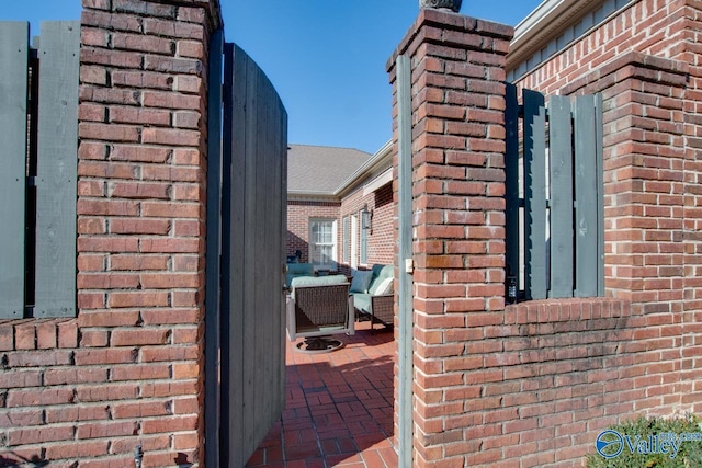 view of side of home with a patio area