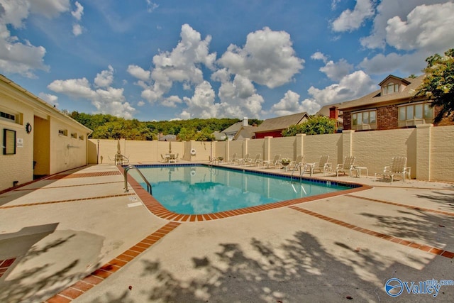 view of swimming pool featuring a patio area