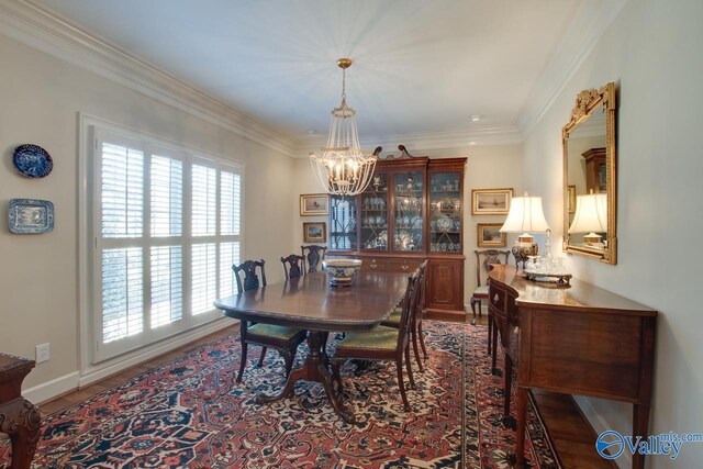 dining space featuring ornamental molding and a chandelier