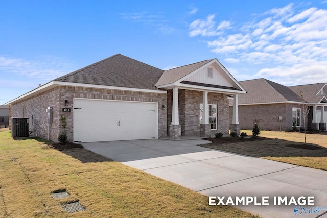 149 Ivy Vine Dr, Toney, AL 35773 - view of front of house featuring cooling unit, a front lawn, brick siding, a garage, and concrete driveway