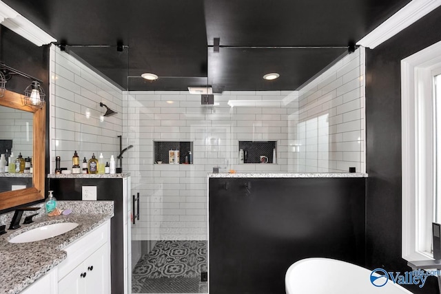 full bathroom featuring vanity and a stall shower