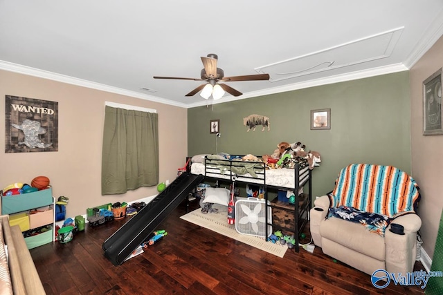bedroom featuring attic access, visible vents, crown molding, and wood-type flooring