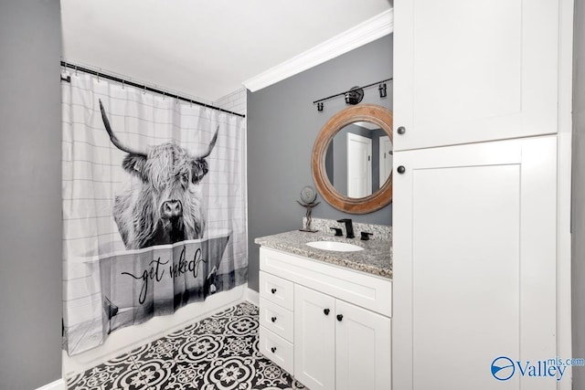full bathroom with tile patterned flooring, ornamental molding, a shower with shower curtain, vanity, and baseboards