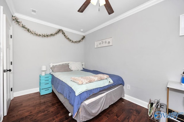 bedroom featuring wood finished floors, crown molding, a ceiling fan, and baseboards