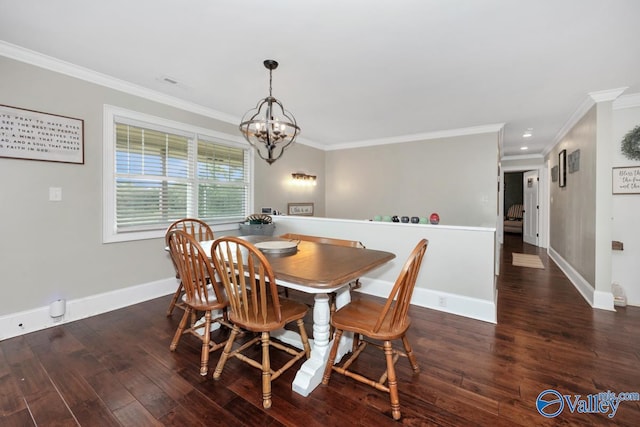 dining space featuring wood finished floors, baseboards, ornamental molding, and a notable chandelier