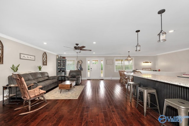 living room featuring a wealth of natural light, ceiling fan, recessed lighting, and dark wood-style floors