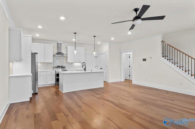 bar featuring pendant lighting, dark wood-type flooring, crown molding, light stone counters, and dark brown cabinetry