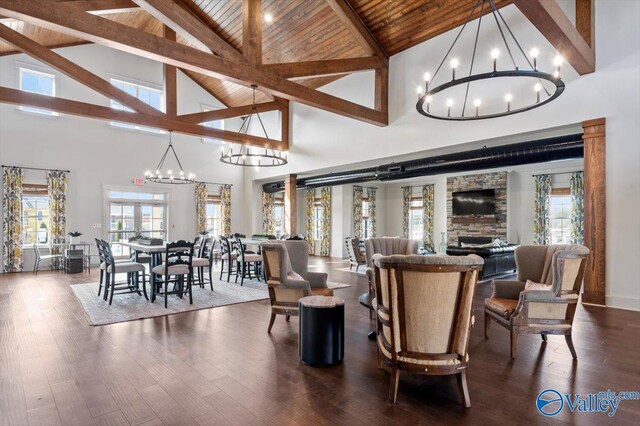 living room with light hardwood / wood-style floors, crown molding, a fireplace, and a wealth of natural light