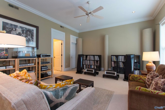 carpeted living room with ceiling fan and crown molding