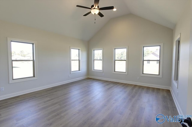 unfurnished room featuring dark wood-type flooring, ceiling fan, and lofted ceiling