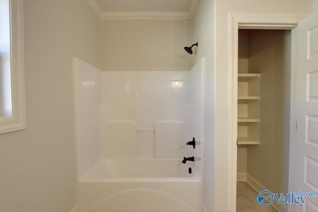 bathroom featuring ornamental molding and tub / shower combination