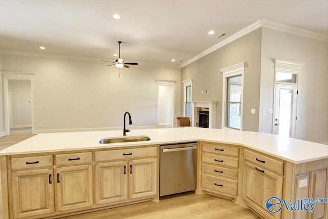 kitchen with sink, dishwasher, ornamental molding, light hardwood / wood-style floors, and light brown cabinetry