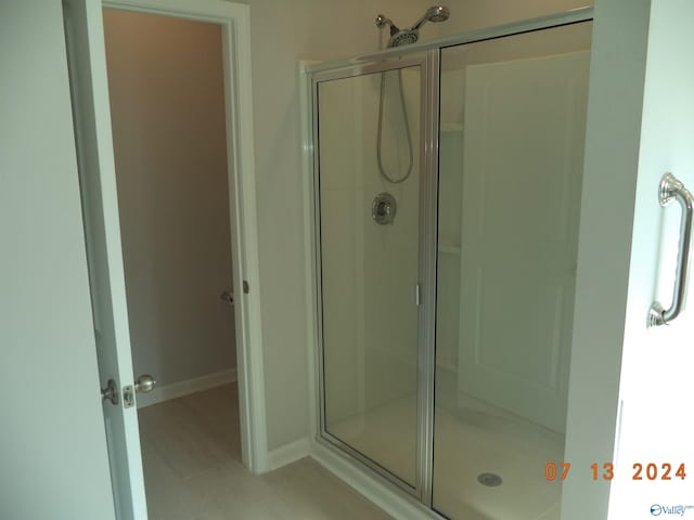 319 Jackson Point Cir, Huntsville, AL 35811 - bathroom with a shower stall and baseboards