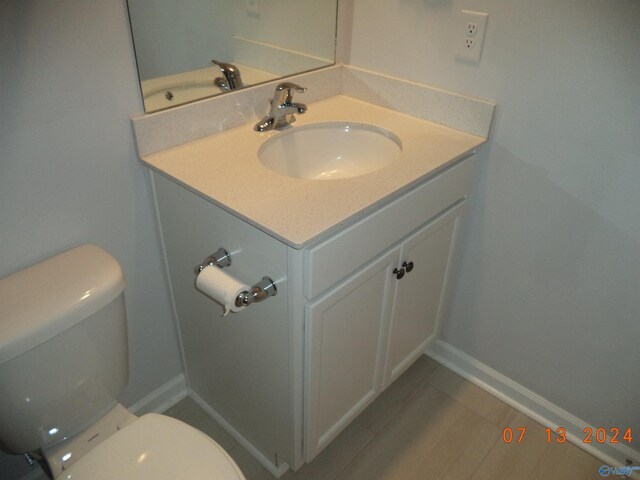 319 Jackson Point Cir, Huntsville, AL 35811 - half bath featuring vanity, toilet, tile patterned floors, and baseboards