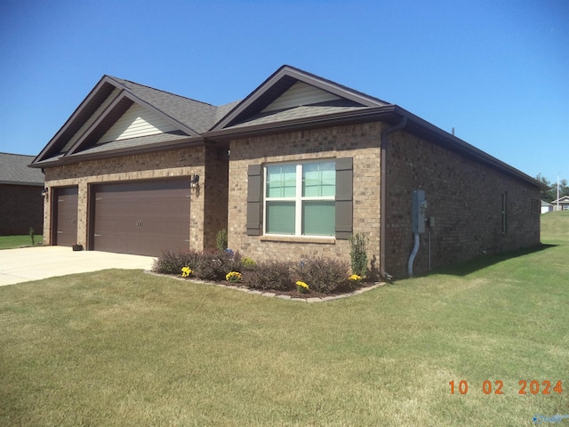 319 Jackson Point Cir, Huntsville, AL 35811 - ranch-style home featuring a front yard, brick siding, driveway, and an attached garage