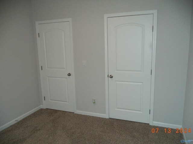 319 Jackson Point Cir, Huntsville, AL 35811 - unfurnished bedroom featuring carpet flooring and baseboards
