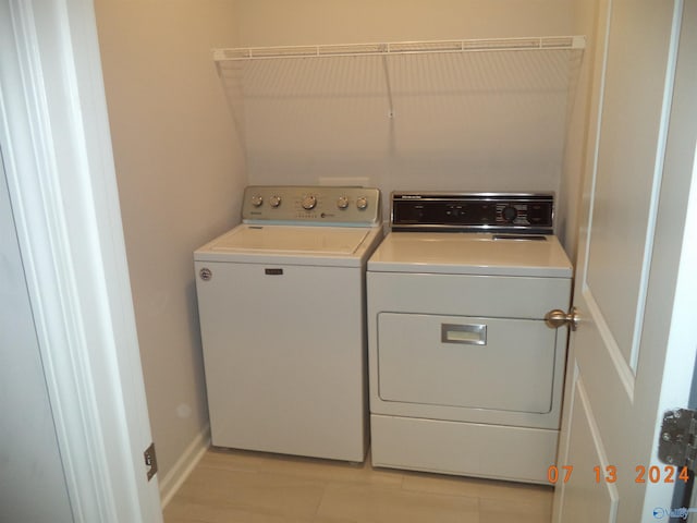 319 Jackson Point Cir, Huntsville, AL 35811 - clothes washing area with washer and dryer