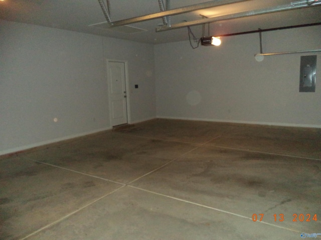 319 Jackson Point Cir, Huntsville, AL 35811 - garage with electric panel, a garage door opener, and baseboards