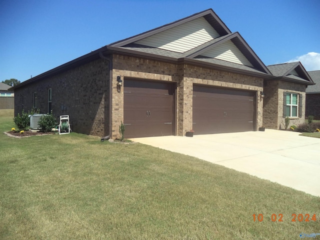 319 Jackson Point Cir, Huntsville, AL 35811 - view of front of home featuring brick siding, an attached garage, a front yard, concrete driveway, and central air condition unit
