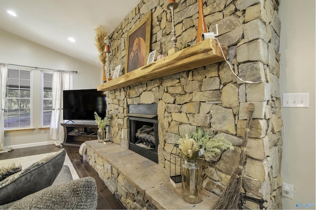 living room with lofted ceiling, a fireplace, and dark hardwood / wood-style floors