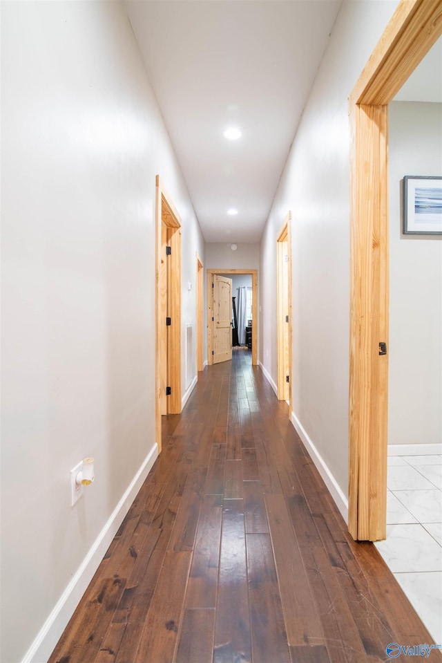 hallway featuring dark hardwood / wood-style flooring