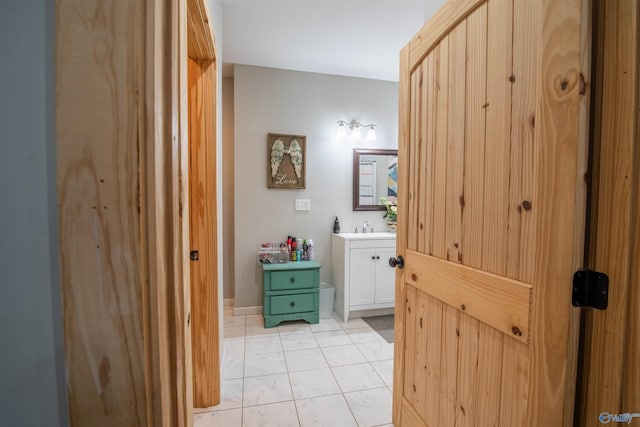 bathroom with tile patterned flooring and vanity