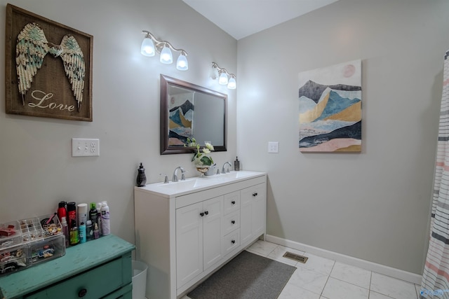 bathroom featuring tile patterned floors and vanity