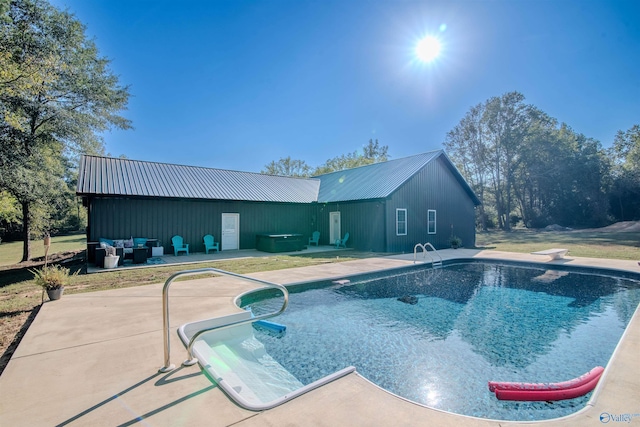 view of pool with a diving board and a patio