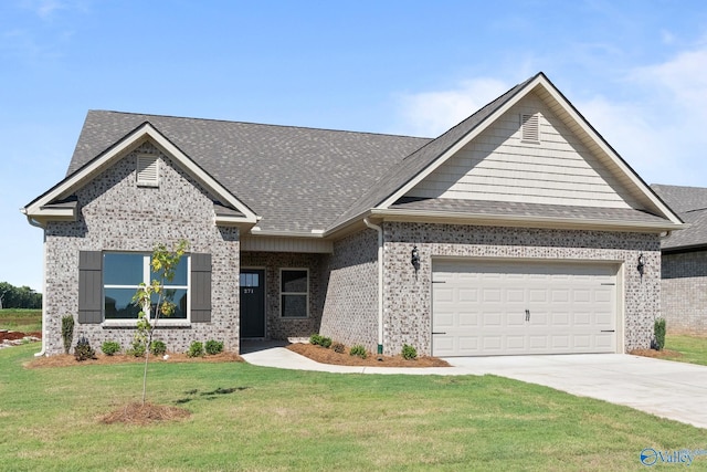 view of front facade with a garage, roof with shingles, a front yard, brick siding, and driveway