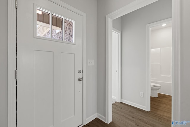 entrance foyer with baseboards and dark wood-style floors
