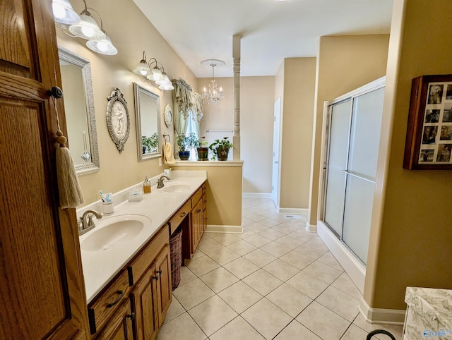 full bath featuring tile patterned flooring, a sink, and a shower stall
