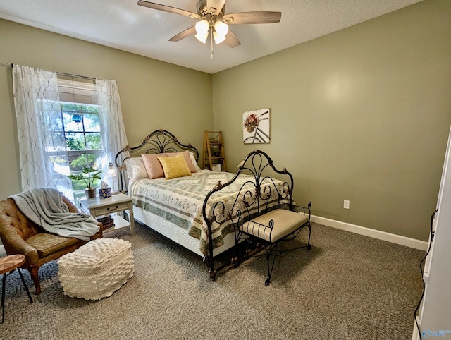 bedroom with ceiling fan, carpet floors, and baseboards