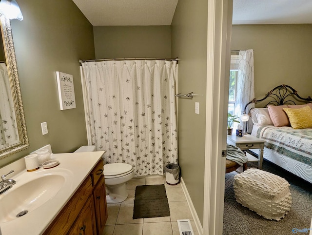 full bathroom with a shower with curtain, visible vents, toilet, vanity, and tile patterned flooring