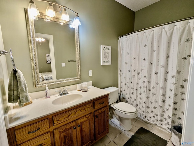 full bath featuring tile patterned floors, vanity, toilet, and curtained shower