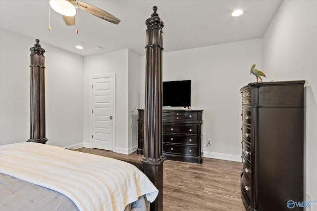 bedroom with ceiling fan and hardwood / wood-style floors