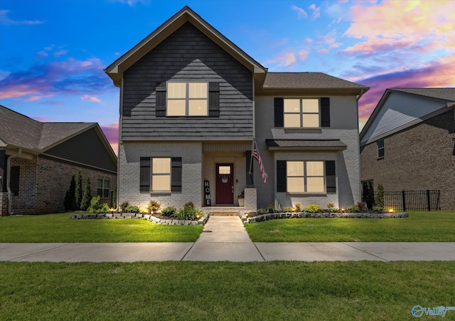 view of front property with a yard