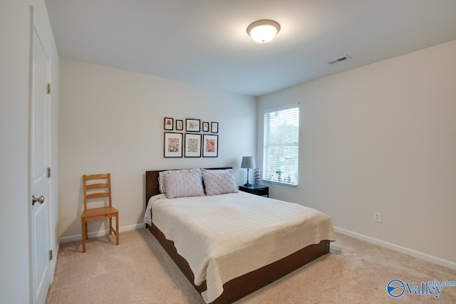 bedroom with light carpet