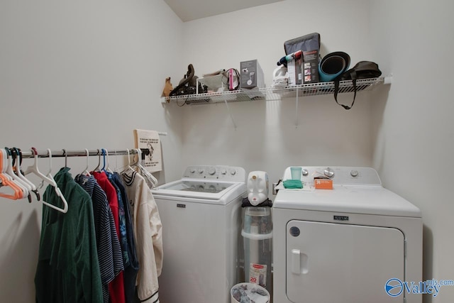 clothes washing area featuring washing machine and dryer