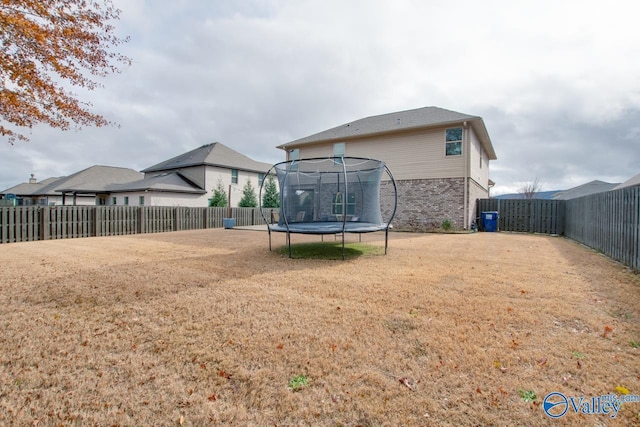 view of yard with a trampoline