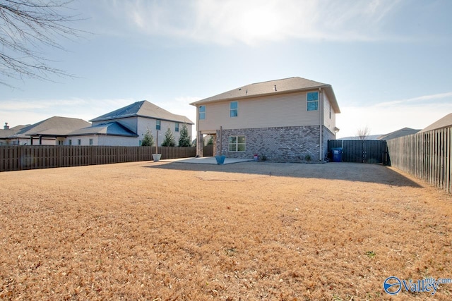 back of property featuring a patio