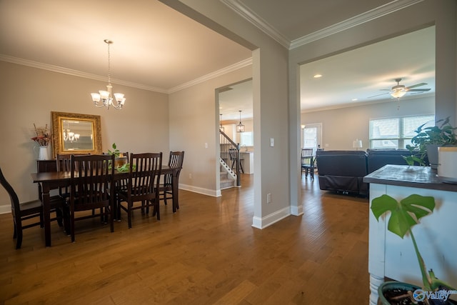 24337 Beacon Cir, Athens, AL 35613 - dining area with a chandelier, wood finished floors, stairs, baseboards, and ornamental molding