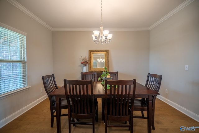 24337 Beacon Cir, Athens, AL 35613 - dining space with a chandelier, baseboards, ornamental molding, and wood finished floors