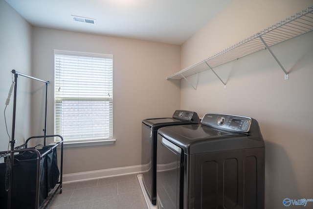 24337 Beacon Cir, Athens, AL 35613 - washroom with washing machine and dryer, baseboards, and tile patterned floors
