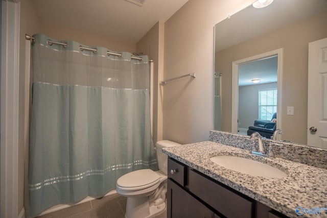 24337 Beacon Cir, Athens, AL 35613 - full bathroom with toilet, tile patterned flooring, vanity, and curtained shower