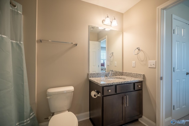 24337 Beacon Cir, Athens, AL 35613 - bathroom with vanity, toilet, and baseboards