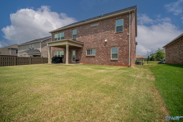 24337 Beacon Cir, Athens, AL 35613 - rear view of property featuring brick siding, a patio area, and central air condition unit